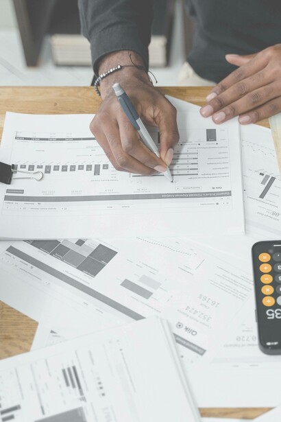 Man uses calculator to study amount owed