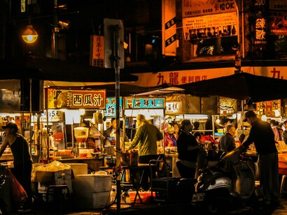 Immersed in difference: crowded streets where unfamiliar signs, sounds, and rhythms rewire perception