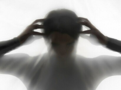 Haunting silhouettes of hands and shadows, evoking anxiety and the torment of a suffering individual