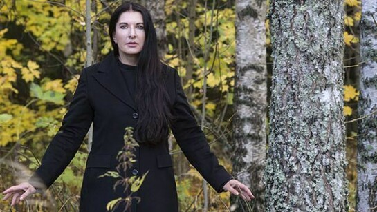 Marina in Black coat in the forest – Portrait of Marina Abramovic, © Knut Bry and Ekebergeparken Oslo, 2013
