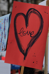 A placard with the word love written on it