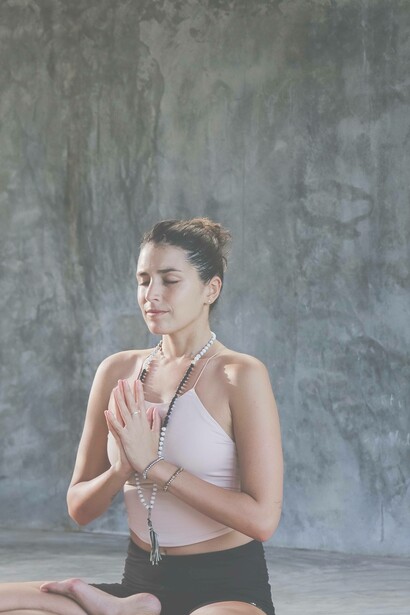 A woman meditates peacefully