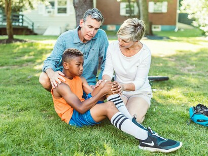 Parent checking on their child’s wellbeing after competition, representing the nurturing side of sports parenting