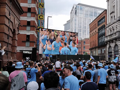 A free event was held in Manchester to celebrate City’s historic Treble—the club becoming only the second English men’s team, after Manchester United in 1998–99, to achieve the “continental treble.” The celebration took place near the Tootal, Broadhurst and Lee Building