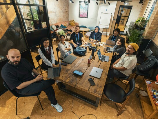 A diverse tech team collaborating in a modern workspace