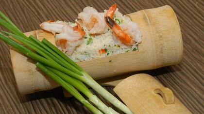 Prawns fried and rice served in bamboo custom