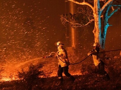 Firefighters try to put out fires
