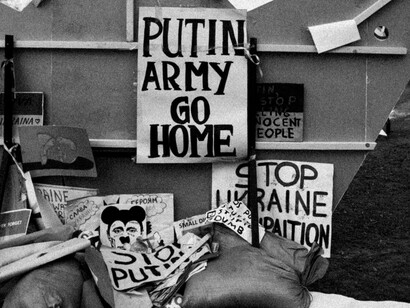 Picket signs protesting Vladimir Putin's invasion of Ukraine