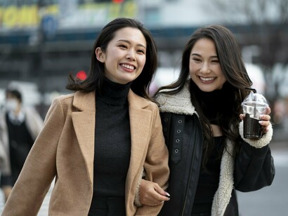 Plainly dressed Japanese women in neutral tones, symbolising the cultural preference for subtlety and restraint