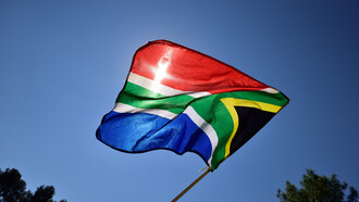 In the spirit of democracy, the South African flag stands tall, symbolising resilience amidst challenging times