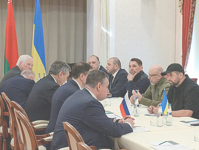 On February 28, 2022, Russian officials on the left and Ukrainian officials on the right engaged in talks held in the Gomel region of Belarus