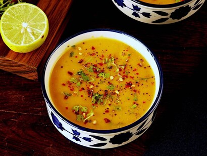 A bowl of Dal Indian lentil soup, lentils are a great source of protein, high in fibre, and complex carbohydrates, while also being low in fat and calories