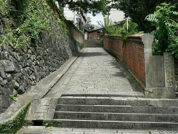 Dutch Slope bordered by stone and brick walls, symbolising the spirit of old Nagasaki