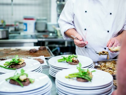 A chef works through a busy service in the kitchen of a high-end restaurant in São Paulo, Brazil