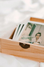 Close-up of pictures in a wooden box