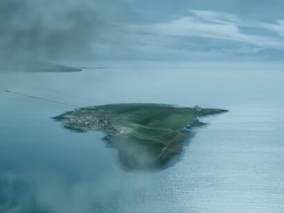 A solitary island emerging from the mist, reflecting the fragile refuge built against an ever-present threat