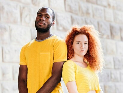 An African American man and a white woman, a couple, radiating happiness and warmth as they enjoy time together