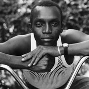 Dawoud Bey, A young man resting on an exercise bike, Amityville, NY, 1988. Courtesy of Denver Art Museum