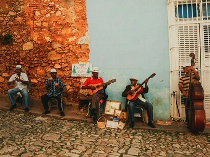 Wearing fedoras and bright shirts, local performers bring live music to life in public spaces—a testament to Cuba's resilient cultural pride amid economic hardship