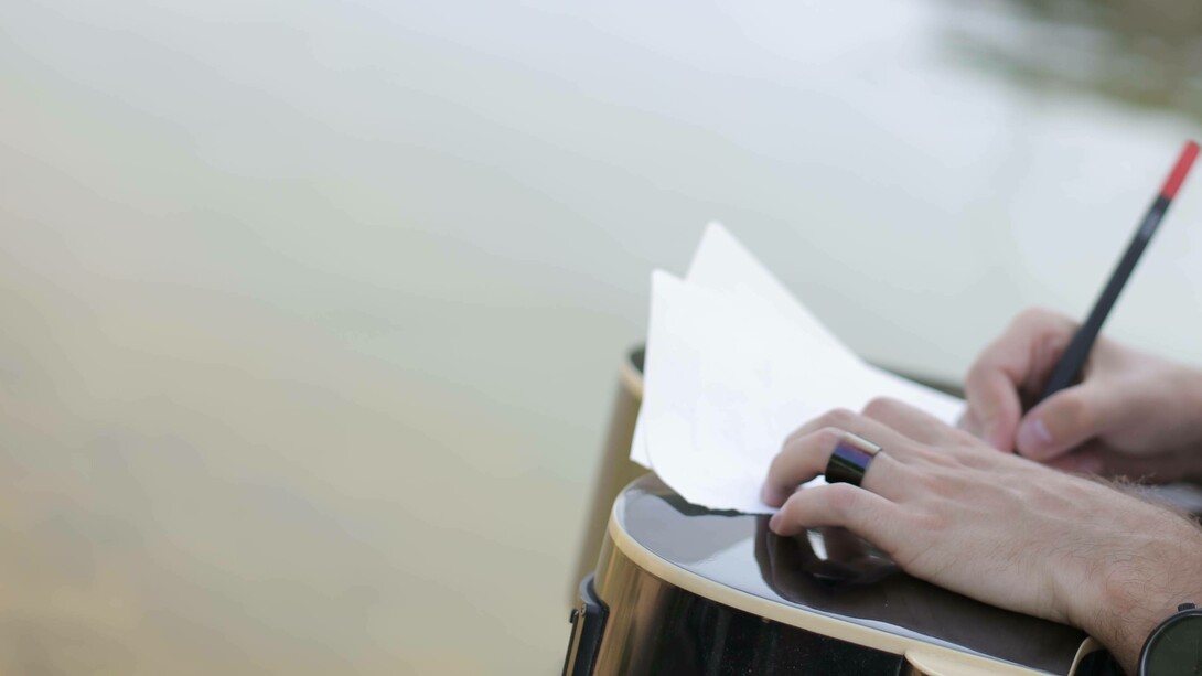Writing a poem by the river