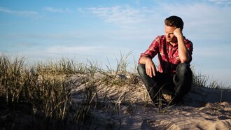 A man doubting his ability and going through the stages of imposter syndrome