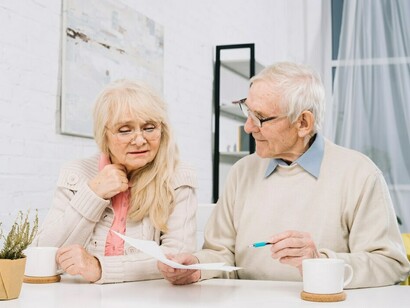 A senior couple enjoying a peaceful moment at home, celebrating their longevity and health