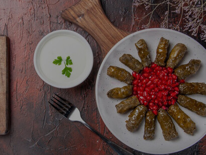 Yaprak sarma, or stuffed grape leaves, is a classic Turkish cuisine dish featuring grape leaves filled with a flavorful blend of rice, herbs, and spices, offering a taste of Turkey's culinary heritage