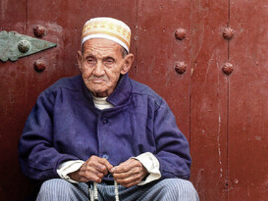 Seated in quiet solitude, the man represents the introspective nature of Ramadan, a time for Moroccans to reconnect with their faith, seek forgiveness, and strengthen their relationship with God