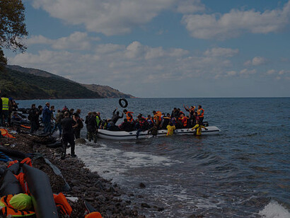 Migrant boat arriving on Lesbos, Greece amid Mediterranean migration crisis