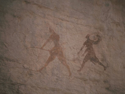 Group in Movement, a cave painting from the Bovidian Period, depicting dynamic figures from the Tassili n'Ajjer region of Algeria