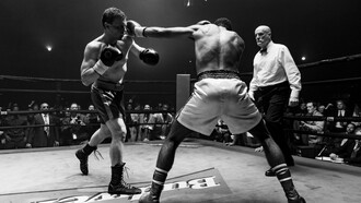 Michael Pitt as Mike Flannigan, fists raised in the heat of battle, is determined to fight not just for victory, but for his redemption in this pivotal moment of his comeback