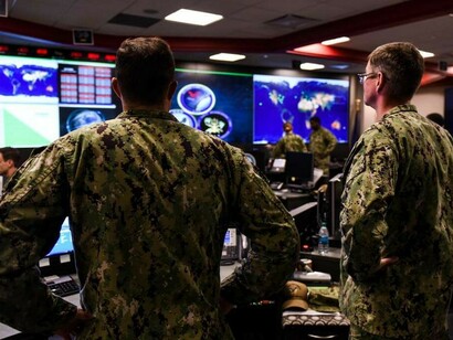 Sailors stand watch in the Fleet Operations Center at Fort George G. Meade, Maryland, headquarters of U.S. Fleet Cyber Command/U.S. 10th Fleet, a global force of active-duty, reserve, and civilian personnel dedicated to cyber operations