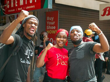 Kenyan youths rally with flags and chants at a vigil honoring protesters lost in nationwide demonstrations