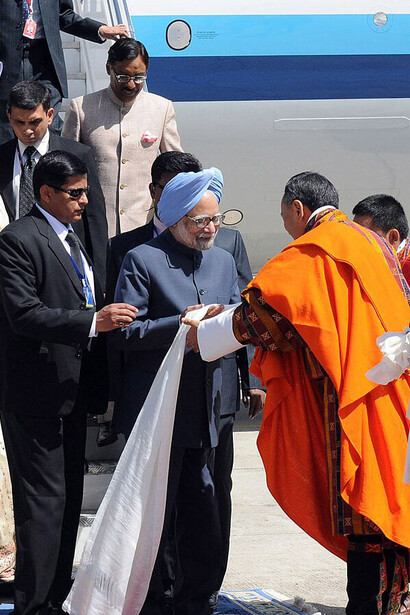 The Prime Minister, Dr. Manmohan Singh being received by the Prime Minister of Bhutan, Mr. Lyonchhen Jigmi Y. Thinley on his arrival at Paro International Airport, to attend the 16th SAARC Summit, in Bhutan on April 28, 2010