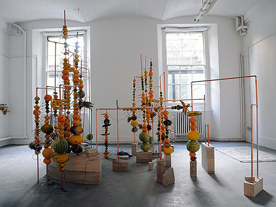 Jeehee Park, fruit battery, 2014. Copper pipes, concrete, fruits, copper clips, zinc plate, variable dimension