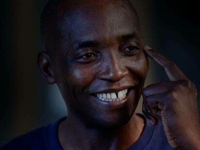 Aboubakahr Soumahoro smiles while telling people to think about his cause to end the injustice