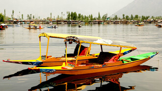 Colourful tour boats drifting across a peaceful lake in Shillong, Meghalaya, India