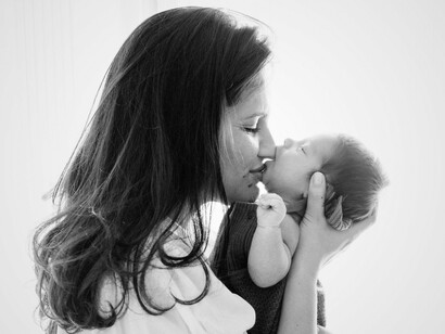 A quiet moment between mother and child—capturing the essence of care, creation, and the overlooked strength of the feminine