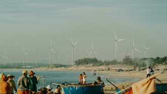 Renewable energy landscapes rise in sunlight while the shadows of heavy industry linger in the distance—a visual metaphor for the shifting balance of global power generation
