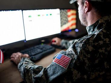 American soldiers analyzing intelligence and coordinating activities from a command center
