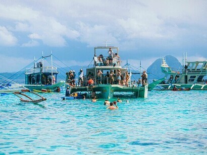 Outrigger boats cutting through open waters, representing lives shaped by motion