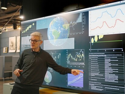 A renewable energy seminar featuring a presentation on a large screen