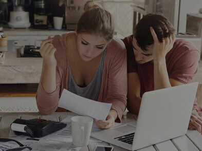 Young family experiencing financial stress due to significant debt and economic concerns