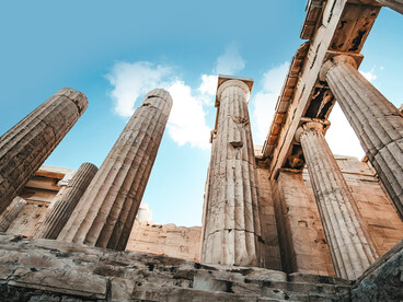 The Parthenon’s columns illuminated by sunlight, rising above ancient ruins, Athens, Greece