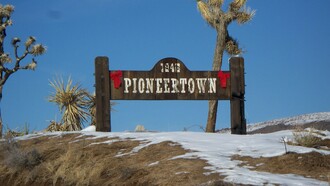 Sign at the town limits of Pioneertown, California, USA, an unincorporated town in San Bernardino County