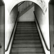 Interior of Meetinghouse, detail of stairway to Ministry’s living quarters, showing doors to brethren’s and sisters’ shoe or cloak rooms on either side (Church Family, Mount Lebanon, New York)