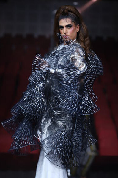 A haute couture model takes the spotlight in India, dressed in exquisite fashion pieces