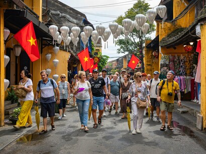 Tourists experiencing Vietnam’s historic streets and cultural atmosphere, reflecting how travel can foster cross-cultural understanding