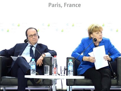 El entonces presidente de Francia, François Hollande, con la premier alemana, Angela Merkel, en el Acuerdo de París (2015)