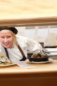 Chef Bengstsson presenting her dishes with a smile